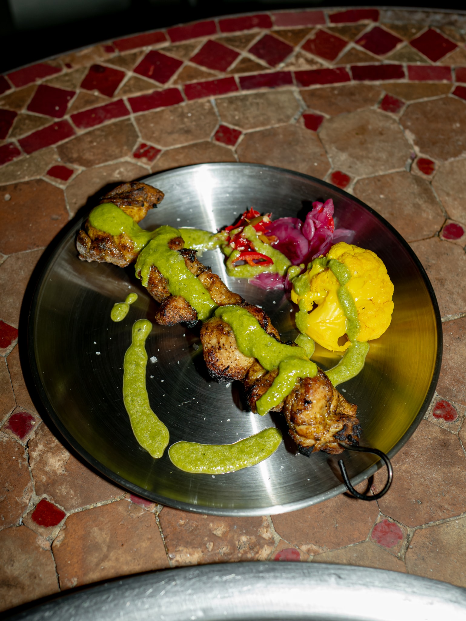 Cue Point grilled meat skewer with peppers and sauce